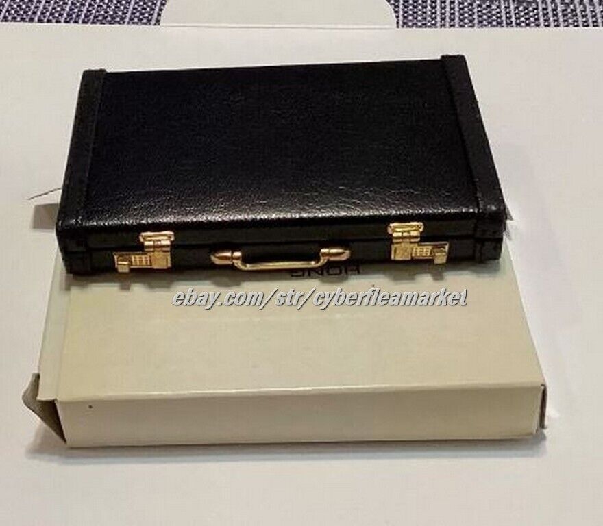 Miniature briefcase executive business card holder with solar calculator