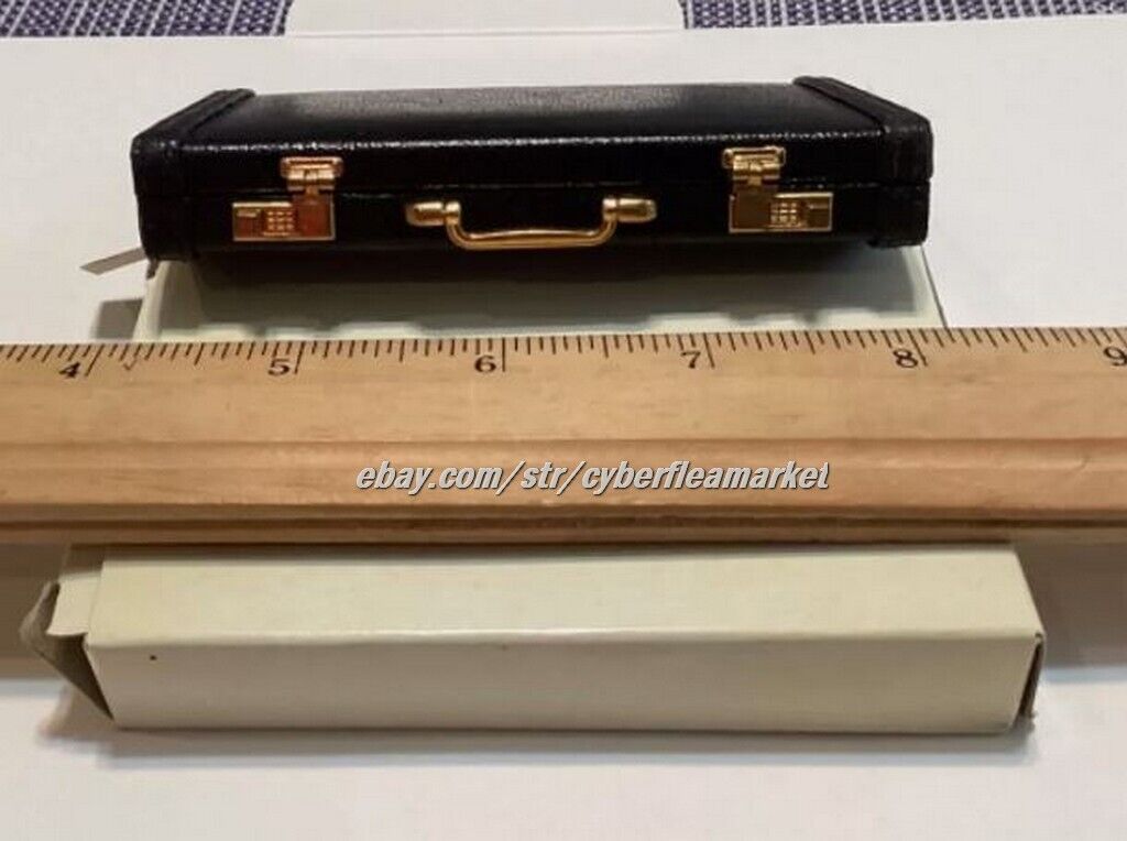 Miniature briefcase executive business card holder with solar calculator