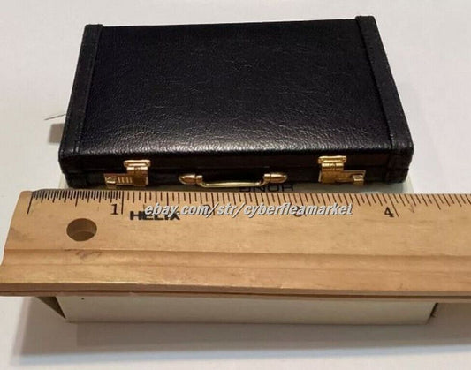 Miniature briefcase executive business card holder with solar calculator