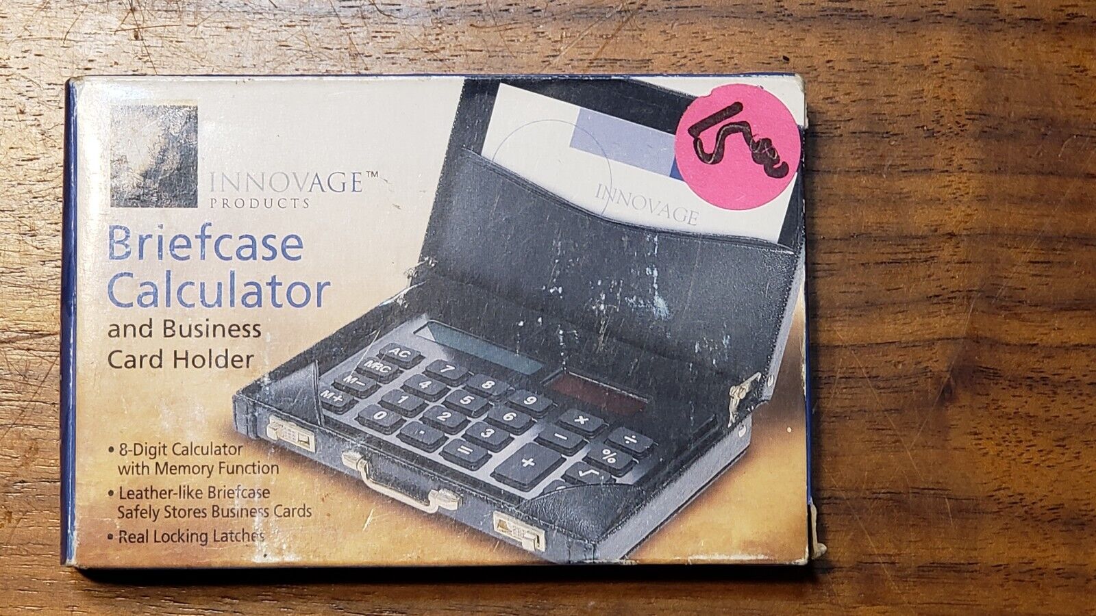 Miniature briefcase executive business card holder with solar calculator